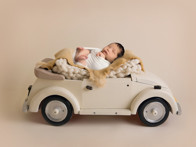 Newborn studio session for Everyn photographed by Jillian Wilhelm Photpgraphy in Windsor Ontario composite image with car