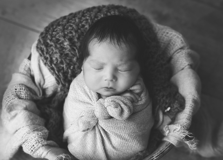 Newborn session with Jillian Wilhelm Photography in windsor ontario Canada black and white bucket pose