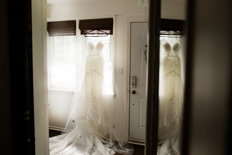 rachelles bridal gown hanging for photographs
