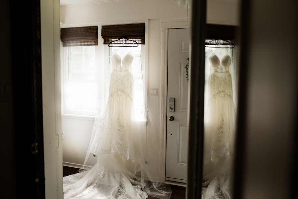 rachelles bridal gown hanging for photographs