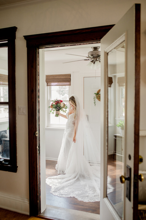 a peak through the door at the bride before the wedding ceremony