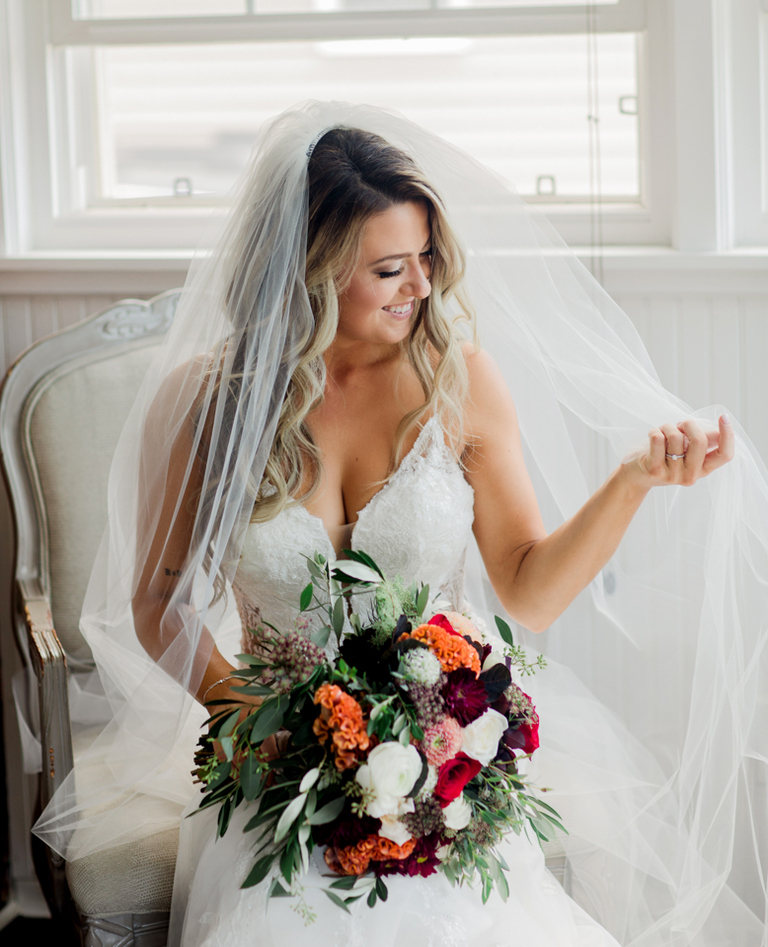 bride playing with veil