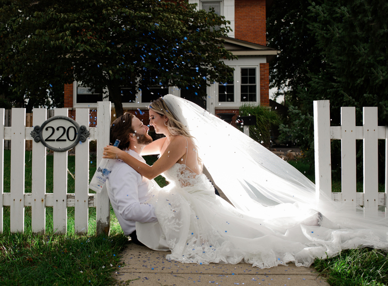 backlit wedding pic of bride and groom grey goose